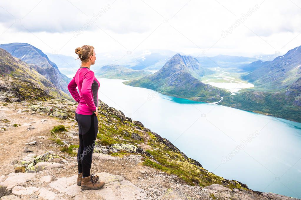 Happy sport woman hiking in Bassegen. Norway