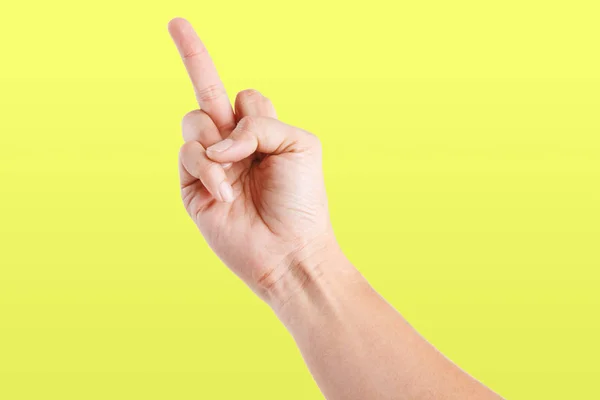 Mannelijke Aziatische Handgebaren Geïsoleerd Gele Achtergrond Middelvinger Pose — Stockfoto