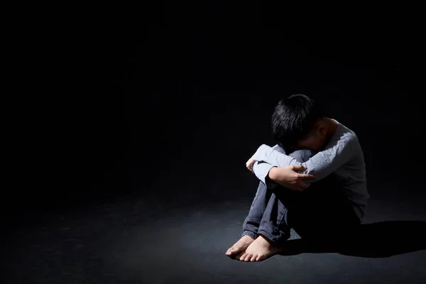 Asian Boy Sitting Floor Face Knee Isolated Black Background Concept — Stock Photo, Image