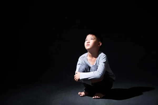 Asian Boy Sitting Floor Face Knee Isolated Black Background Concept — Stock Photo, Image