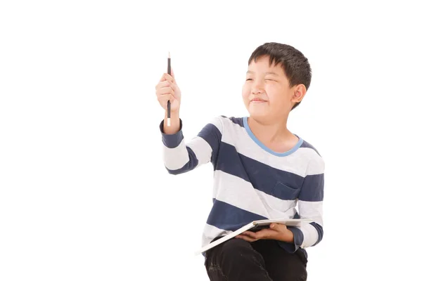 Asiatischer Junge Schreibt Auf Weißem Hintergrund Einen Plan Der Luft — Stockfoto