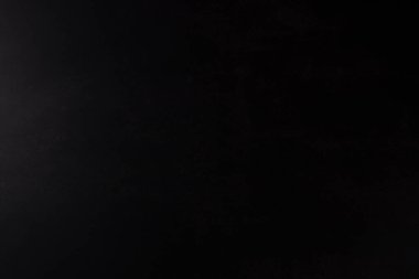 Siyah Kağıt Arka plan, soldan gelen ışık. Kopyalama Aralığı.