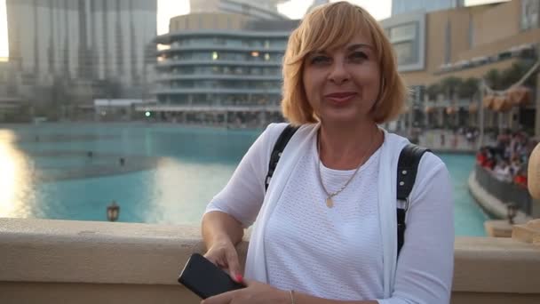 Happy Female Tourist Smiling Water Channel Quay Burj Khalifa Her — Stock Video