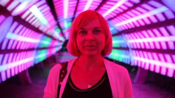 Cheery Woman Standing Futuristic Channel Blue Red Neon Lamps Optimistic — Stock Video