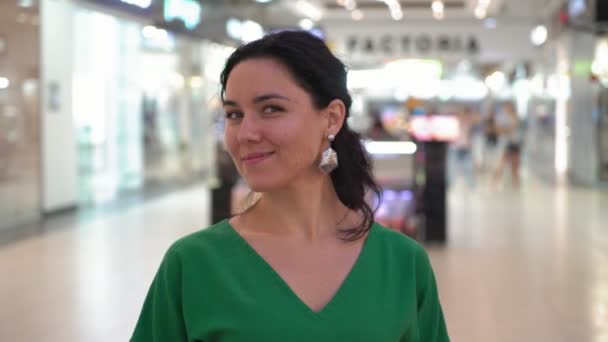 Happy Brunette Woman Green Dress Smiling Standing Spacious Hall Portrait — Stock Video