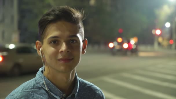 Sportive Man Listening Music Standing Street Traffic Night Portrait Smiling — Stock Video
