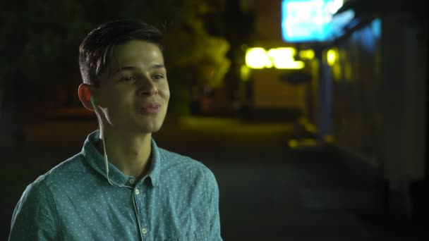 Sportive Young Man Eating Cookies Smiling Happily Street Night Portrait — Stock Video