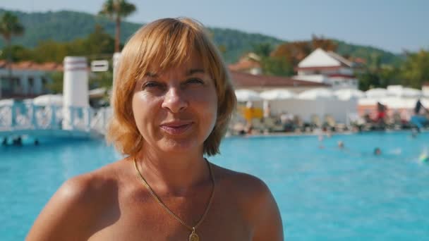 Cheery Blond Woman Standing Smiling Sea Shore Blue Waves Slo — Stock Video