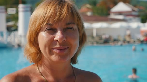 Happy Blond Woman Standing Smiling Sea Resort Blue Waters Slo — Stock Video