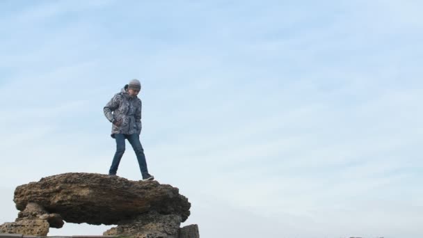 Happy Boy Jacket Jumping Rock Sunny Day Slo Impressive View — Stock Video