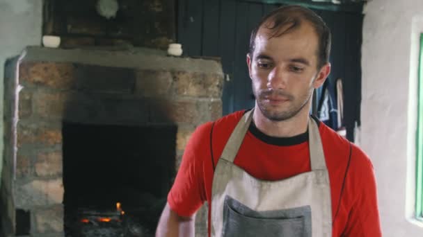 Young Blacksmith Apron Putting Huge Hammer His Shoulder Workshop Impressive — Stock Video