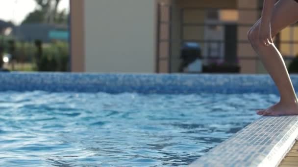 Happy Brunet Boy Jumping Feet First Paddling Pool Slow Motion — Αρχείο Βίντεο