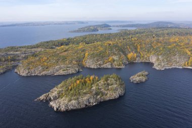 Russia. Karelia from the drone. Shooting Karelia from the air. Karelian landscape. Natural scenery.  Ladoga skerries. Rocky island in lake Ladoga. Nature of Russia. clipart