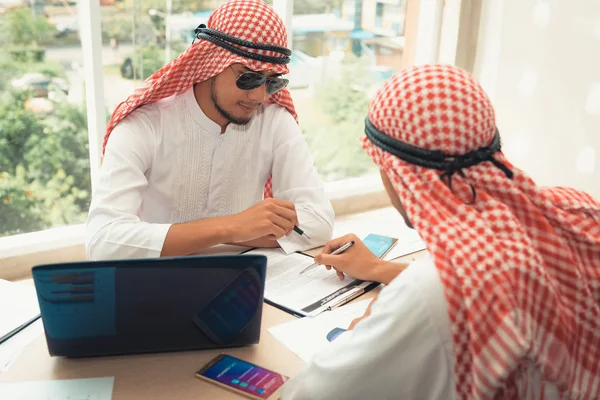 Businessmen Arabian are signature contract agreement together in office room.