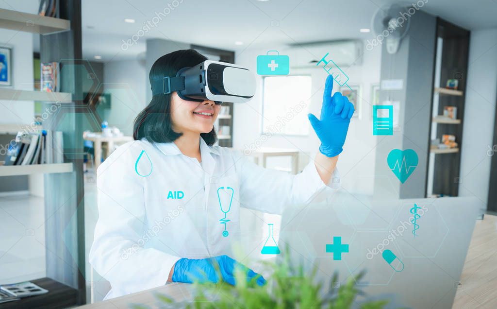 Portrait of scientist is using virtual reality technology to selection tools and examining research in her office., Technology and occupational concept.