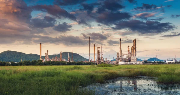 Landscape of Oil and Gas Refinery Manufacturing Plant., Petrochemical or Chemical Distillation Process Buildings., Factory of Power and Energy Industrial at Twilight Sunset, Engineering Petroleum.
