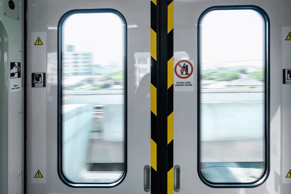 Automatic Metro Skytrain Doorway Inside Vehicle Transport Seat, Electric Security Entrance Door of Public Transportation Train in Urban City While Operating Movement. Passengers Safety System Concept.