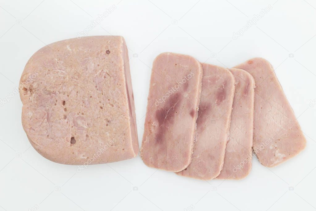 Canned ham slices isolated on white background - top view photo