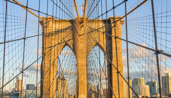 Brooklyn Bridge at sunset in the district of Brooklyn, New York, USA
