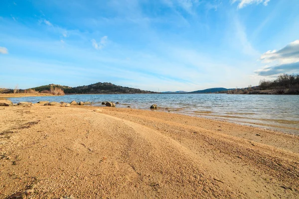 stock image Beautiful lake in the mountains at sunset on a sunny day with blue sky 