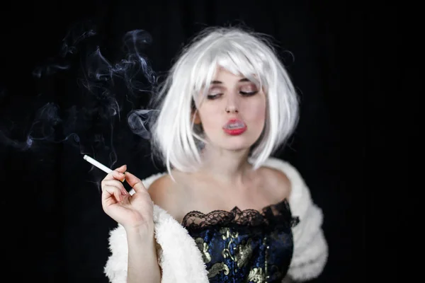 Attractive Young Woman Costume Smoking Cigar Looking Camera While Standing Royalty Free Stock Images