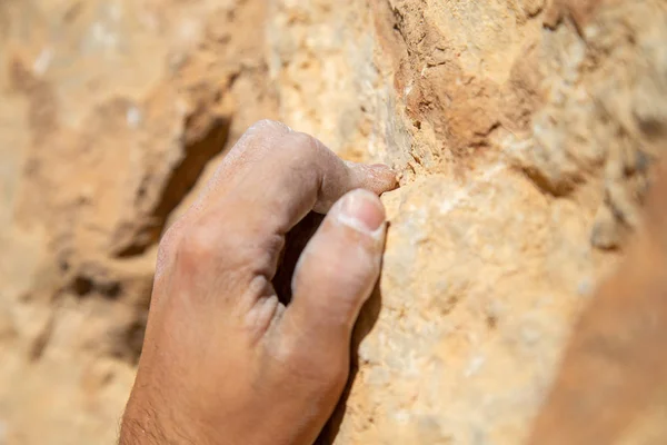 Crop Male Hand White Chalk Powder Hanging Rough Rock While — Stock Photo, Image