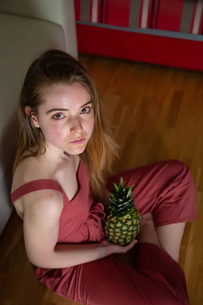 Young Tired Female Sitting Floor Pineapple — 스톡 사진