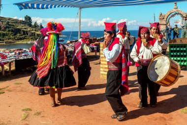 Musicians and dancers in the peruvian Andes on Taquile Island. P clipart