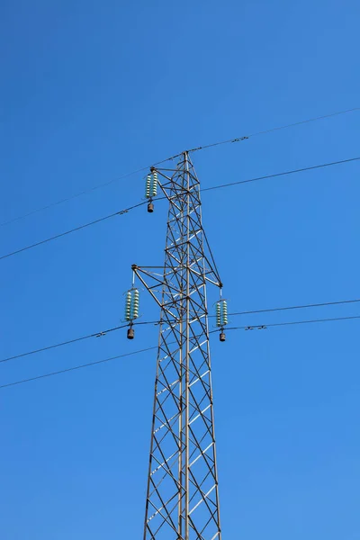 Electrical power line on a blue sky background