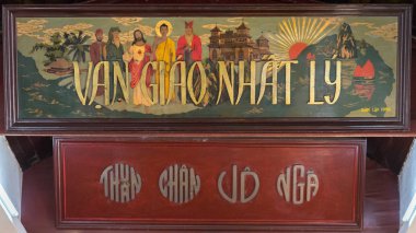 Da Nang, Vietnam - March 25, 2019: a painting that depicts Jesus Christ, Buddha, Laozi, Confucius & Muhammad in Trung Hung Buu Toa Cao Dai, a Caodaist temple. Cao Dai combines world religions into one clipart
