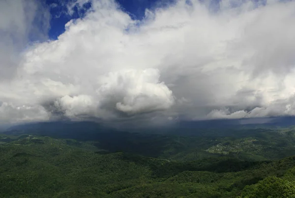 majestic sky with clouds over the green hills. panorama