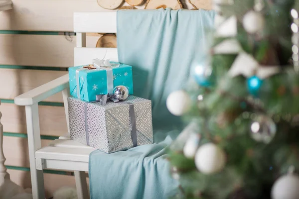 Beautiful white and turquoise boxes with gifts under the Christmas tree — Stock Photo, Image