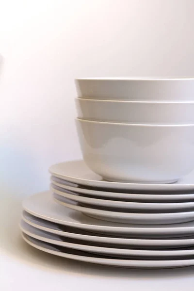 white dishes on white background