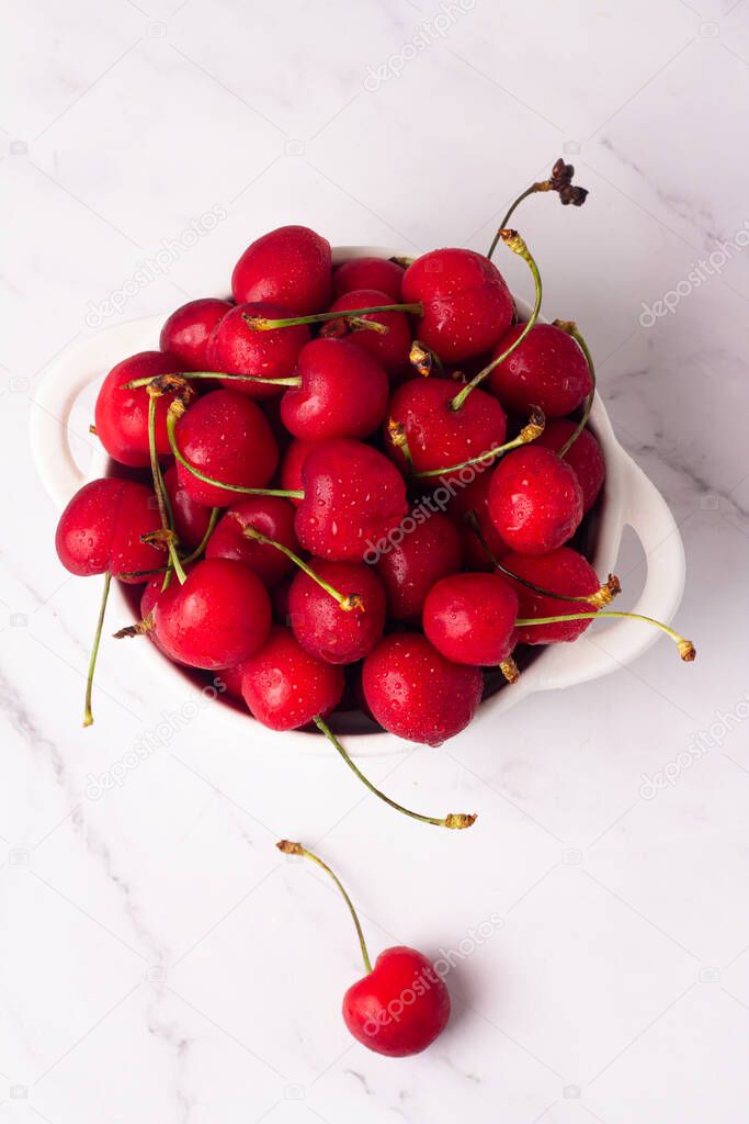 red fresh cherry in a plate