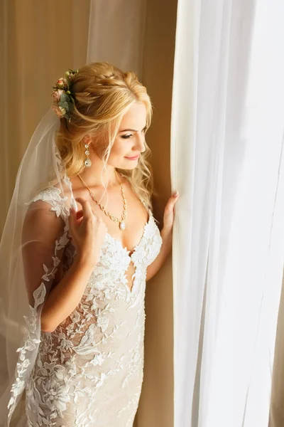 Portrait of bride near the window — Stock Photo, Image