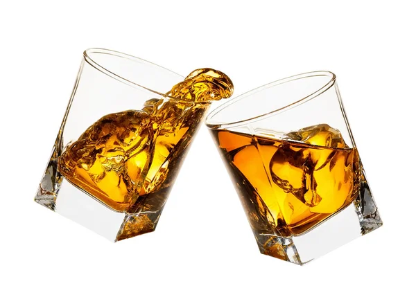 Glasses of whiskey making toast — Stock Photo, Image