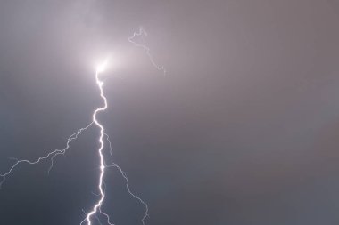 Thunderstorm near the city of Trieste, Italy , lightning beats the water clipart