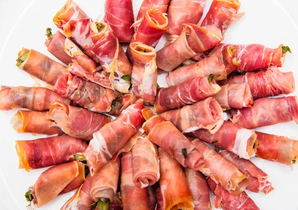 Rolls of ham on a plate. View from above Stock Photo