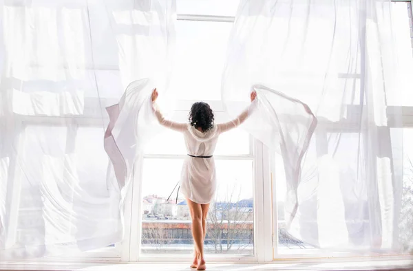 Photo Young Woman Stands Window Open Curtains — Stock Photo, Image