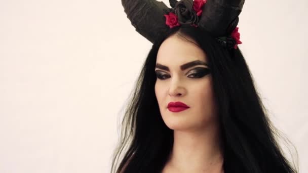 Girl in a fairy-tale image with horns on her head — Stock Video