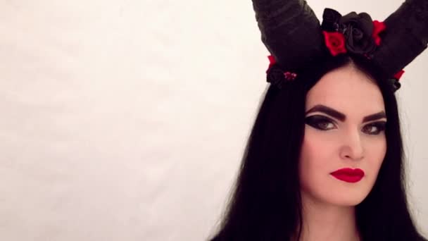 Girl in a fairy-tale image with horns on her head — Stock Video