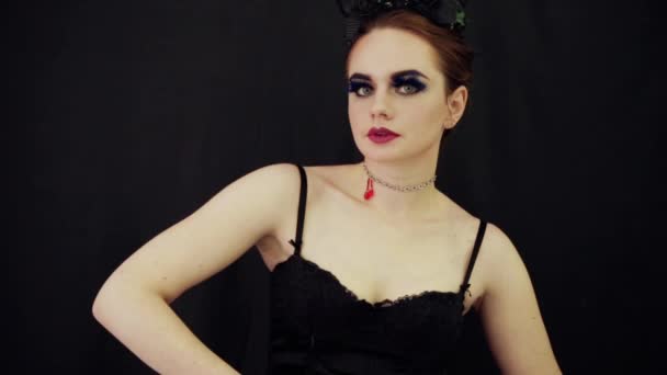 A girl in a corset and with horns on her head — Stock Video