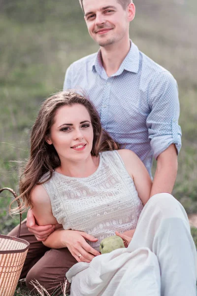 Lovers man and woman together at a picnic — Stock Photo, Image