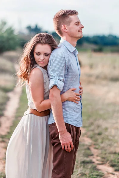 Stylish adult guy and girl hugging . Vertical photo — Stock Photo, Image