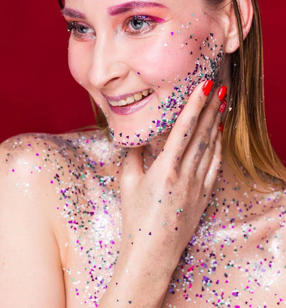 Happy fashion model woman with trendy glitter make-up