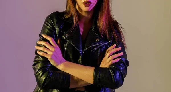 Girl in a leather jacket in the studio with color filters — Stock Photo, Image