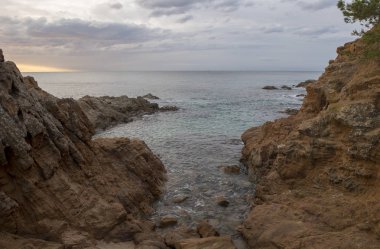 Gün doğumunda Lloret de Mar Fenals plaj
