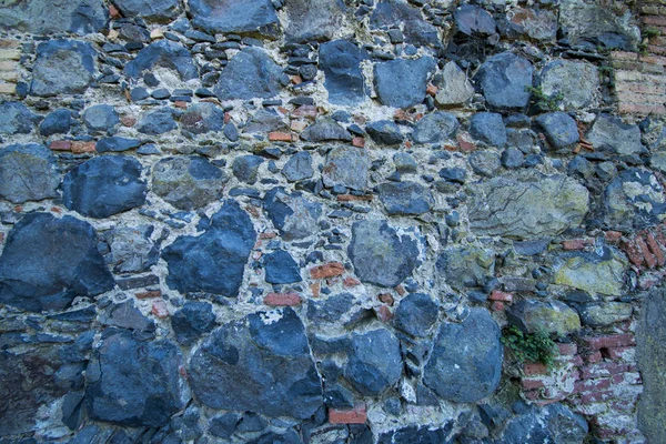 En bakgrund av en tegel stenmur — Stockfoto