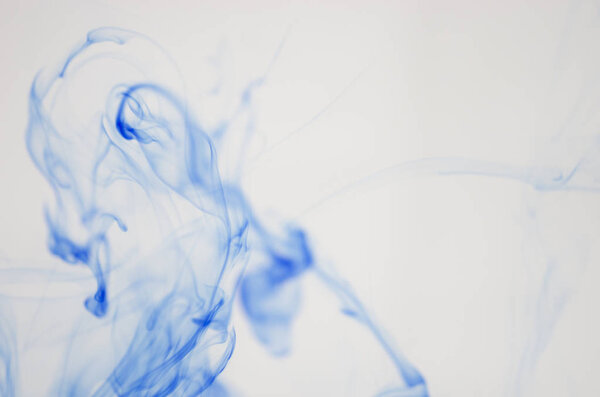 clouds of blue smoke over white background