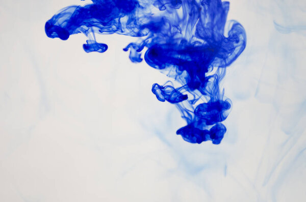 clouds of blue smoke over white background